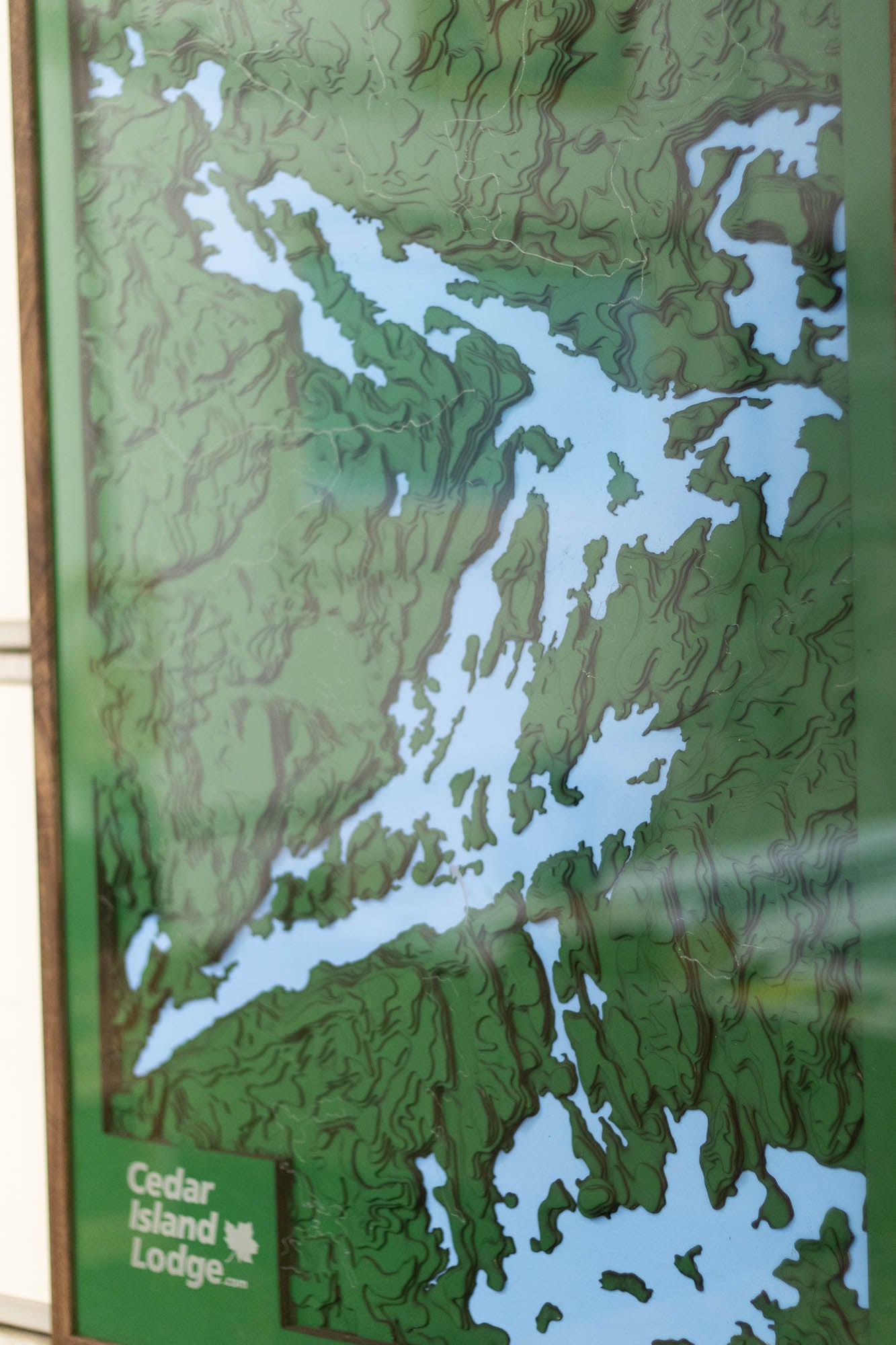 Topographical map of Pipestone Lake in Ontatio Canada. Also has Cedar Island Lodge Logo