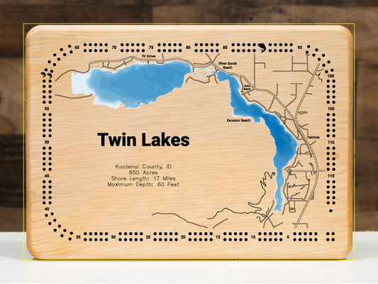 A precision laser-cut, multi-layered wooden map of Twin Lakes in 
Kootenai County, Idaho. The natural wood top layer meticulously 
captures the 17-mile shoreline, while the recessed water layers 
feature a vibrant light-to-dark blue gradient representing the 
60-foot depth. This elegant 3D topographic art piece is a 
sophisticated home decor item, perfect for cabin walls or modern 
interiors looking for a rustic, handcrafted touch.