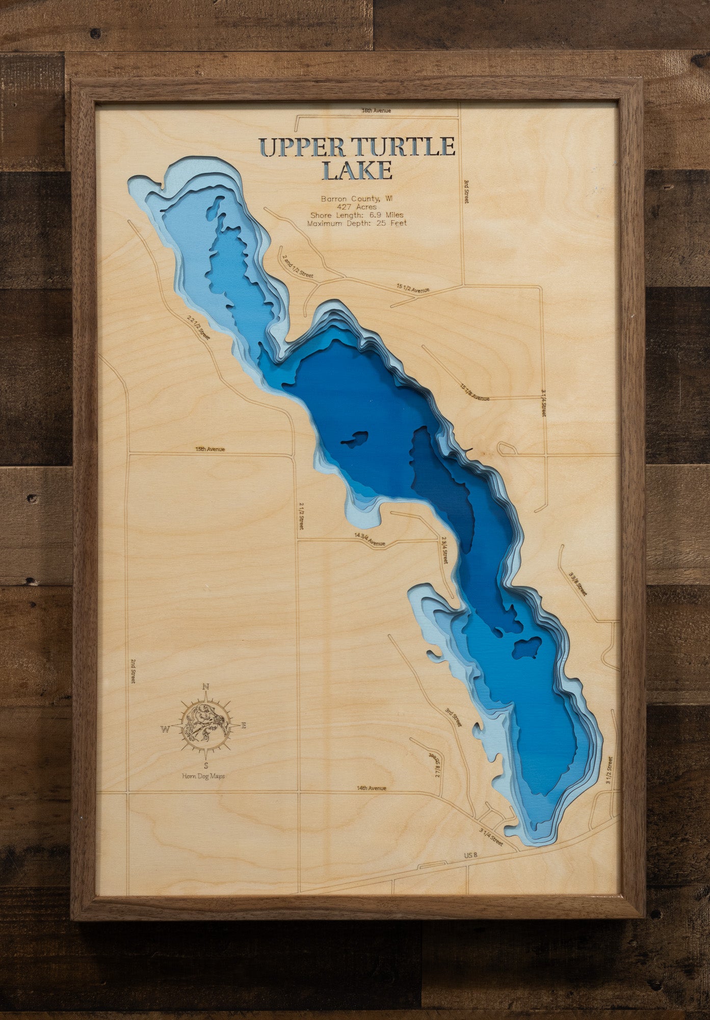 A laser-cut, layered wood map of Upper Turtle Lake, Barron County, Wisconsin, illustrating its shoreline and surrounding landscape.