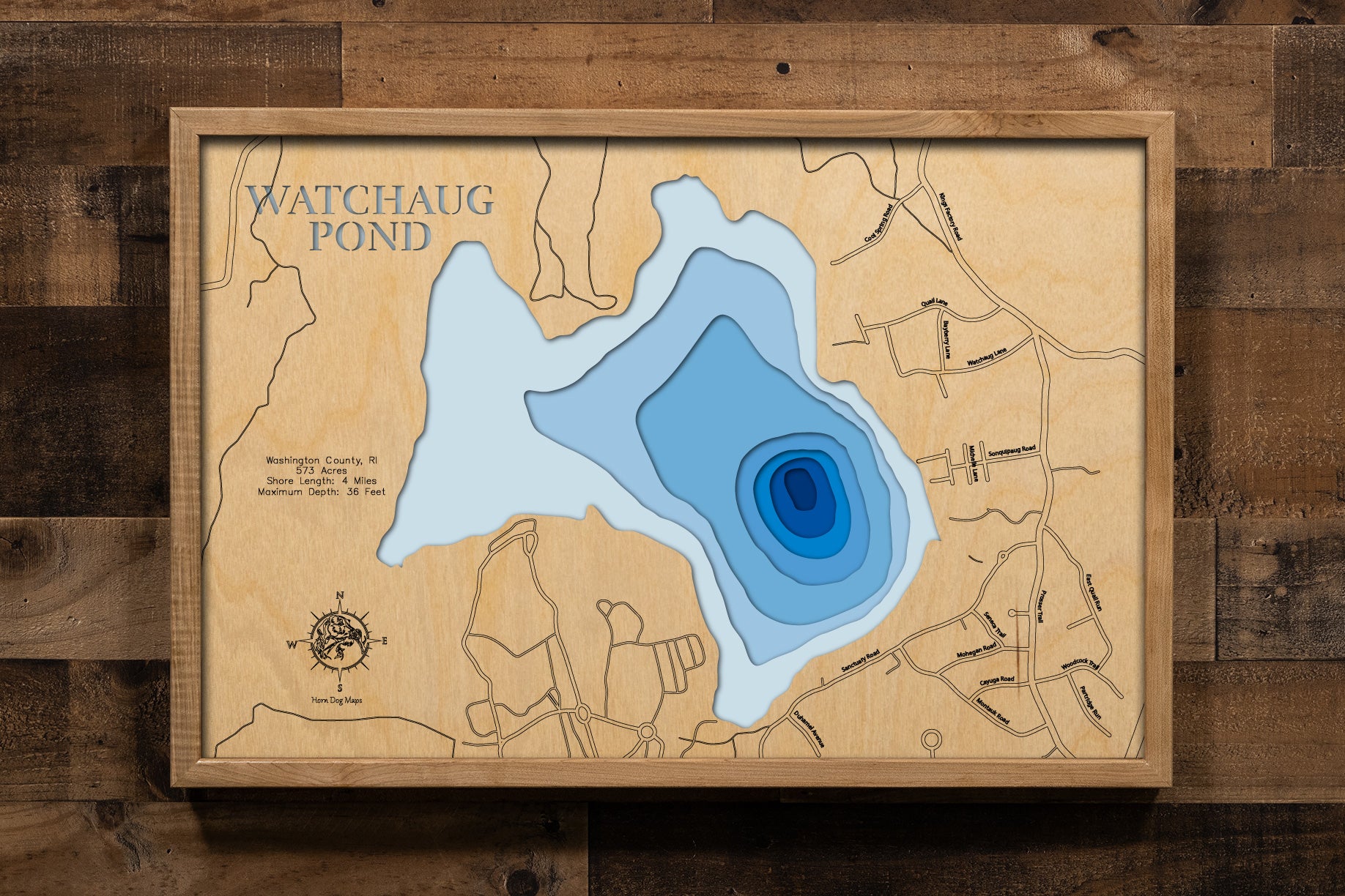 A masterfully crafted, multi-layered laser-cut wooden topographic map of Watchaug Lake in Washington County, Rhode Island. The detailed design captures the 573-acre kettle pond's distinctive glacial formation, eight-foot average depth with 36-foot maximum depth areas, the winding four miles of shoreline through Burlingame State Park, and the surrounding 3,100 acres of protected woodland.