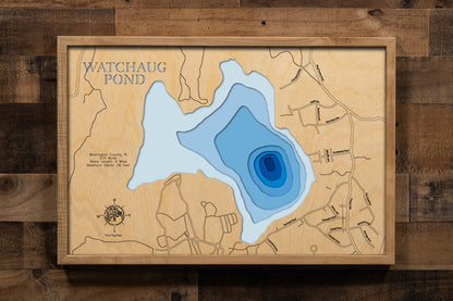 A masterfully crafted, multi-layered laser-cut wooden topographic map of Watchaug Lake in Washington County, Rhode Island. The detailed design captures the 573-acre kettle pond's distinctive glacial formation, eight-foot average depth with 36-foot maximum depth areas, the winding four miles of shoreline through Burlingame State Park, and the surrounding 3,100 acres of protected woodland.