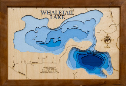 Detailed wooden relief map of Whaletail Lake in Hennepin County, MN, showcasing its natural beauty.