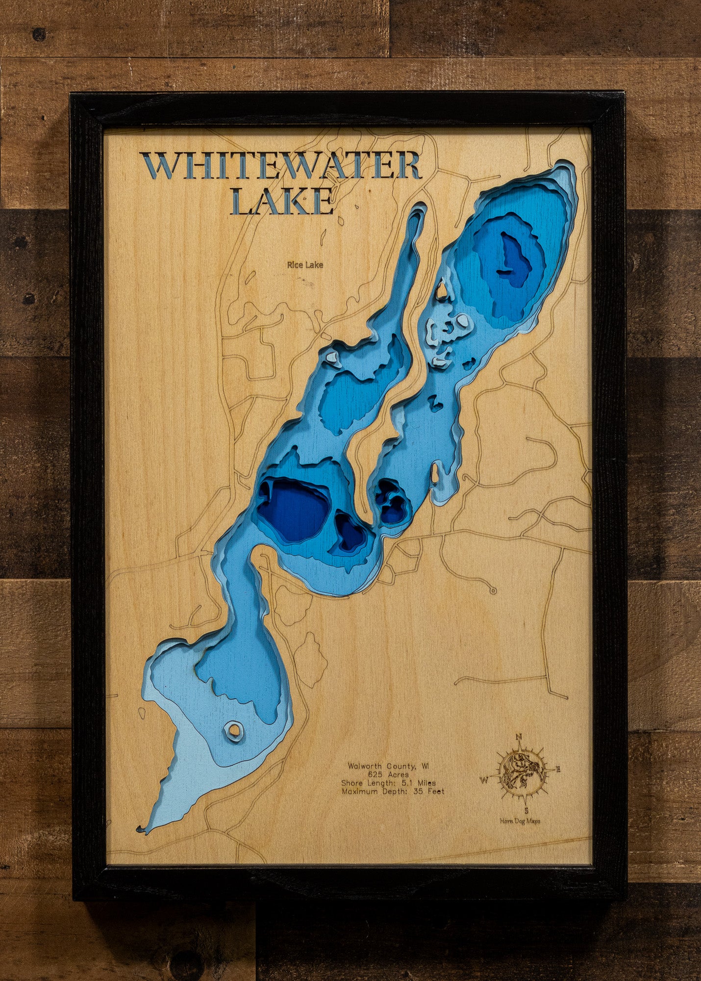 Artisanally carved wooden lake map of Whitewater Lake in Walworth County, WI, highlighting bathymetry.