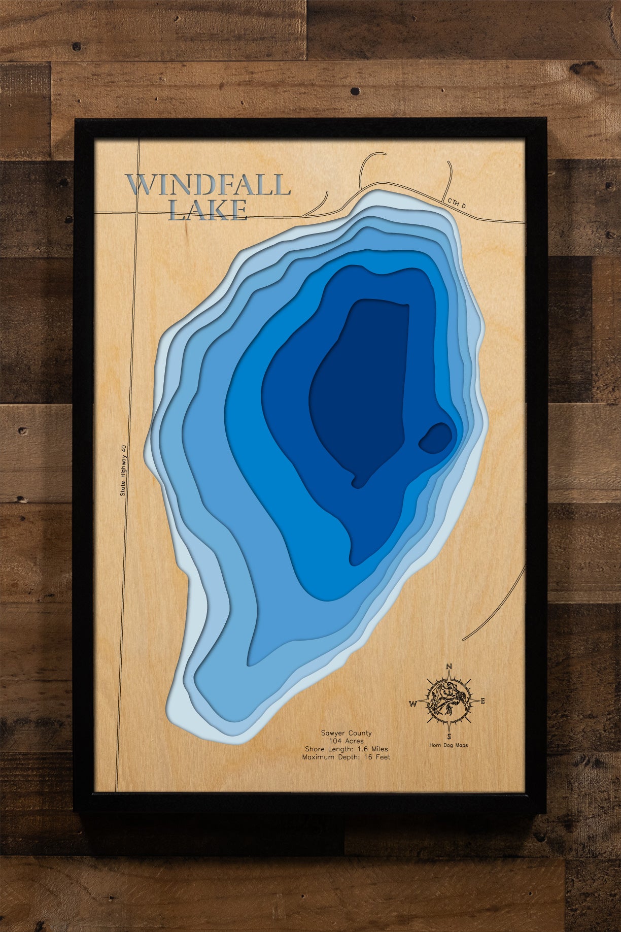 Laser-engraved relief map of Windfall Lake in Sawyer County, WI, crafted from wood with high precision.