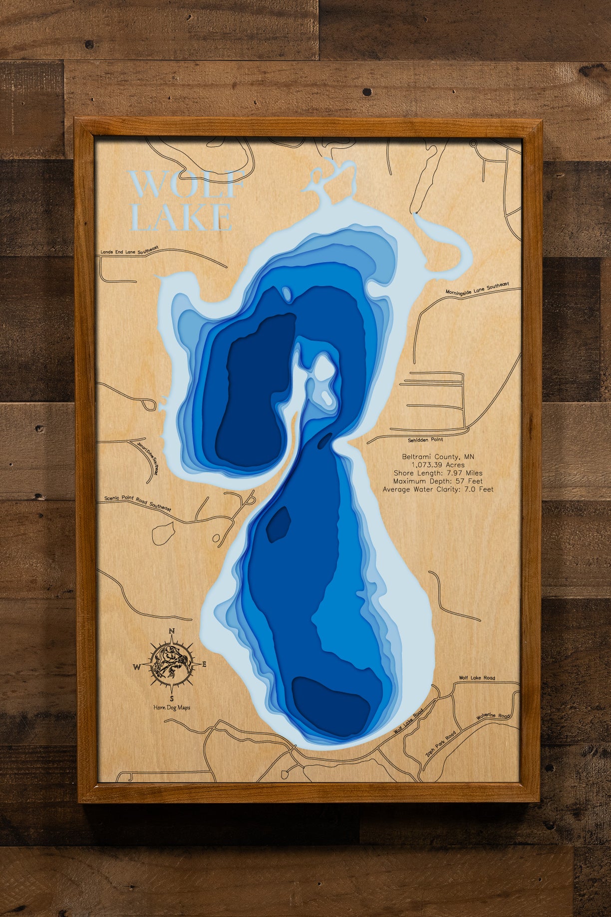 Detailed wooden relief map of Wolf Lake in Beltrami County, MN, showcasing its natural beauty.