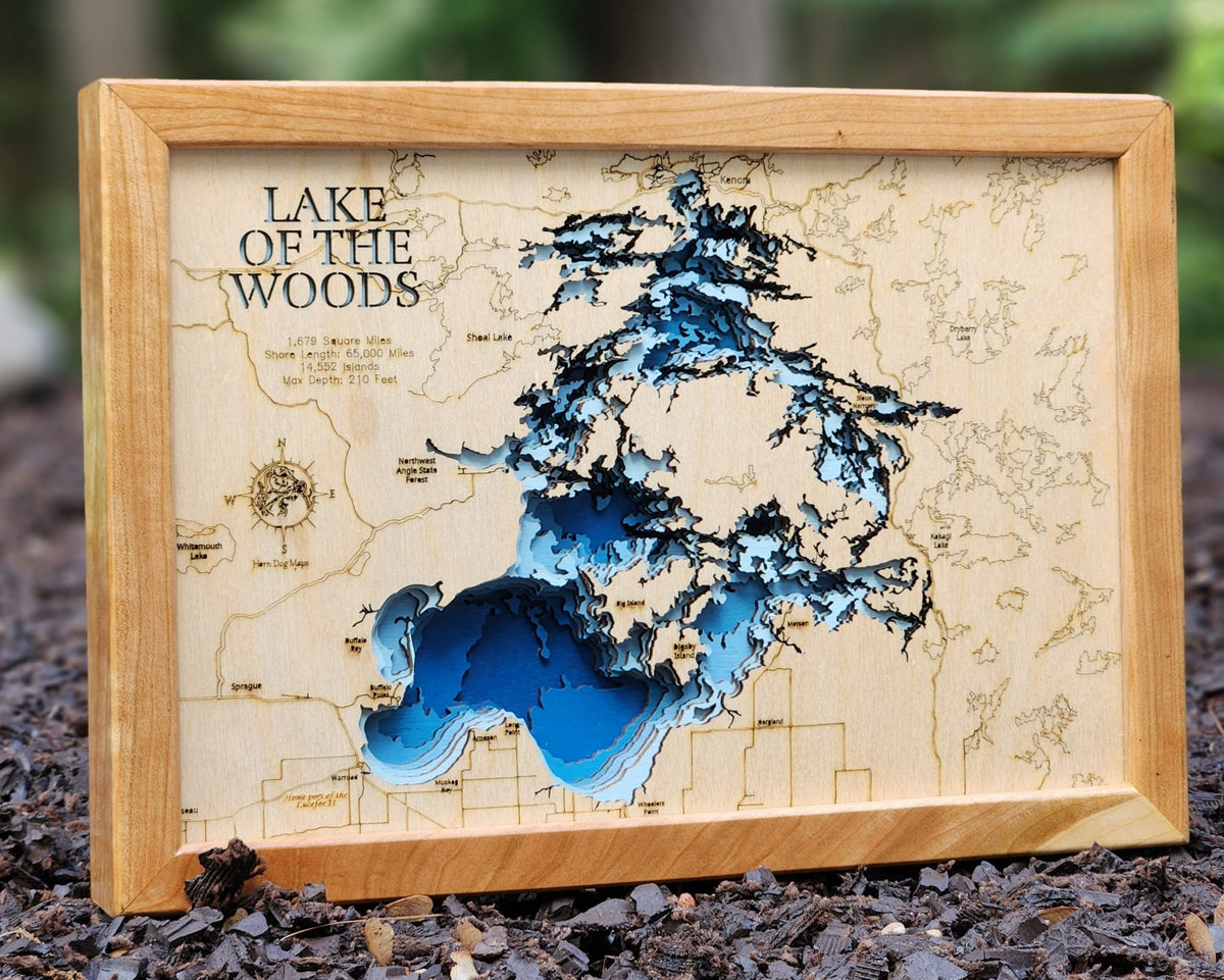 3D Lake of the Woods Map(Minnesota and Ontario) in a cherry frame in an outdoor natural light setting.