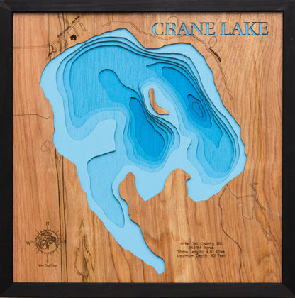 Laser-engraved relief map of Crane Lake in Otter Tail County, MN, crafted from wood with high precision.