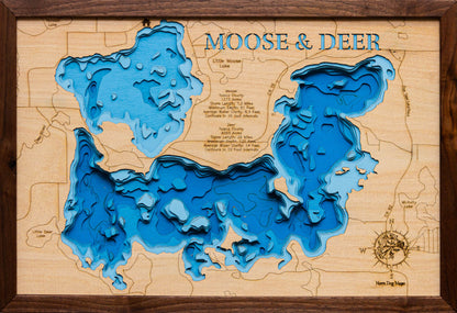 Laser-engraved relief map of Moose Lake and Deer Lake in Itasca County, MN, crafted from wood with high precision.